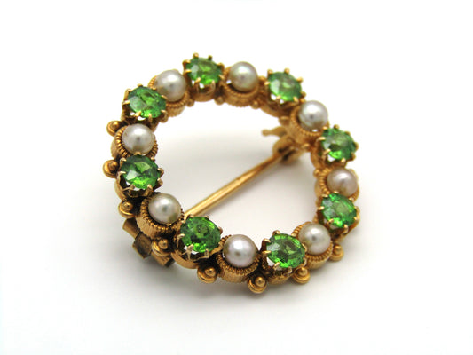 Edwardian, 18K gold demantoid garnet and pearl circle brooch