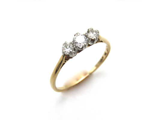 Mid-century 18K gold and platinum three-stone diamond ring