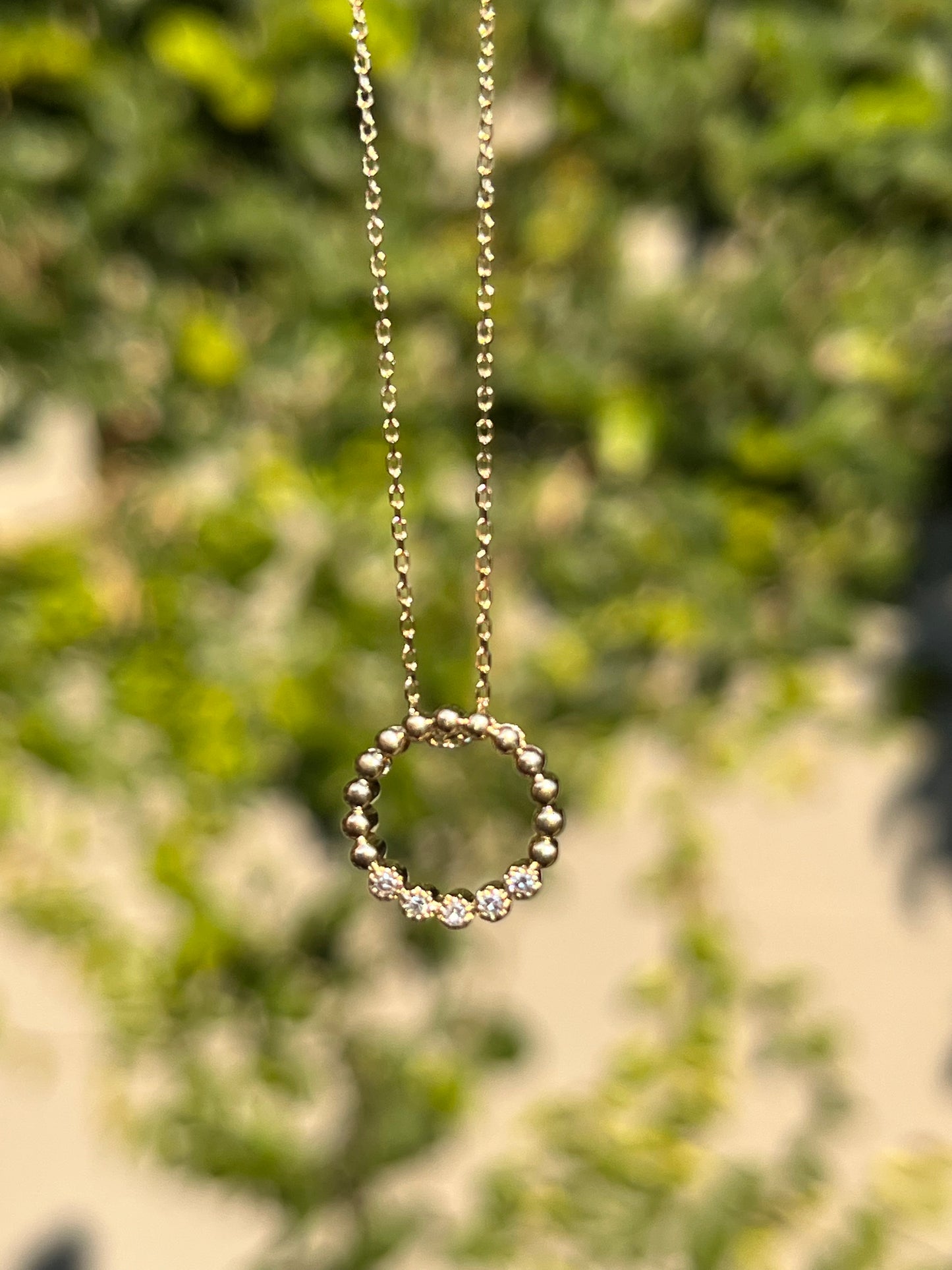 Estate, 9K gold diamond 'circle' pendant