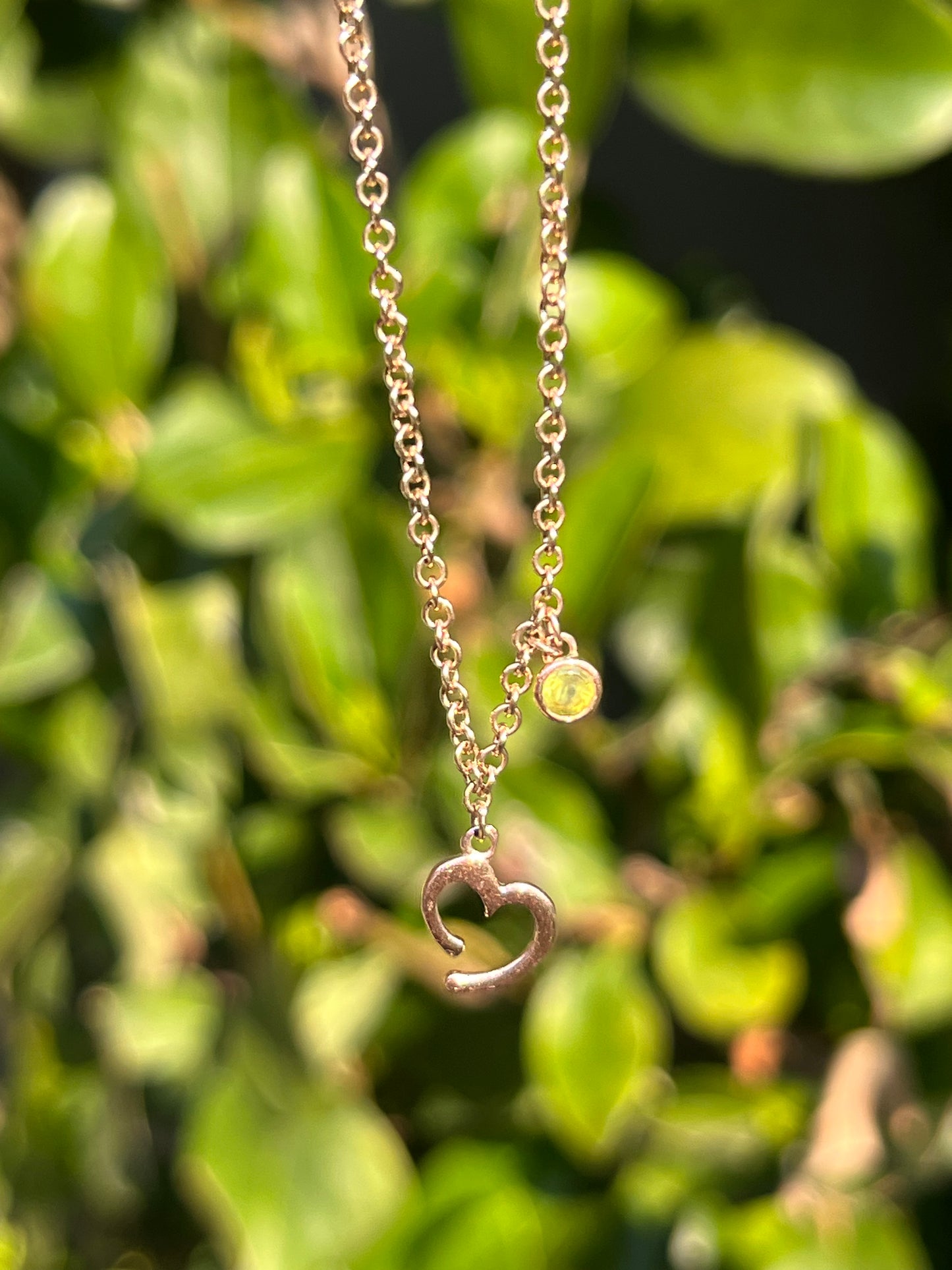 Estate, 9K gold peridot and open heart necklace