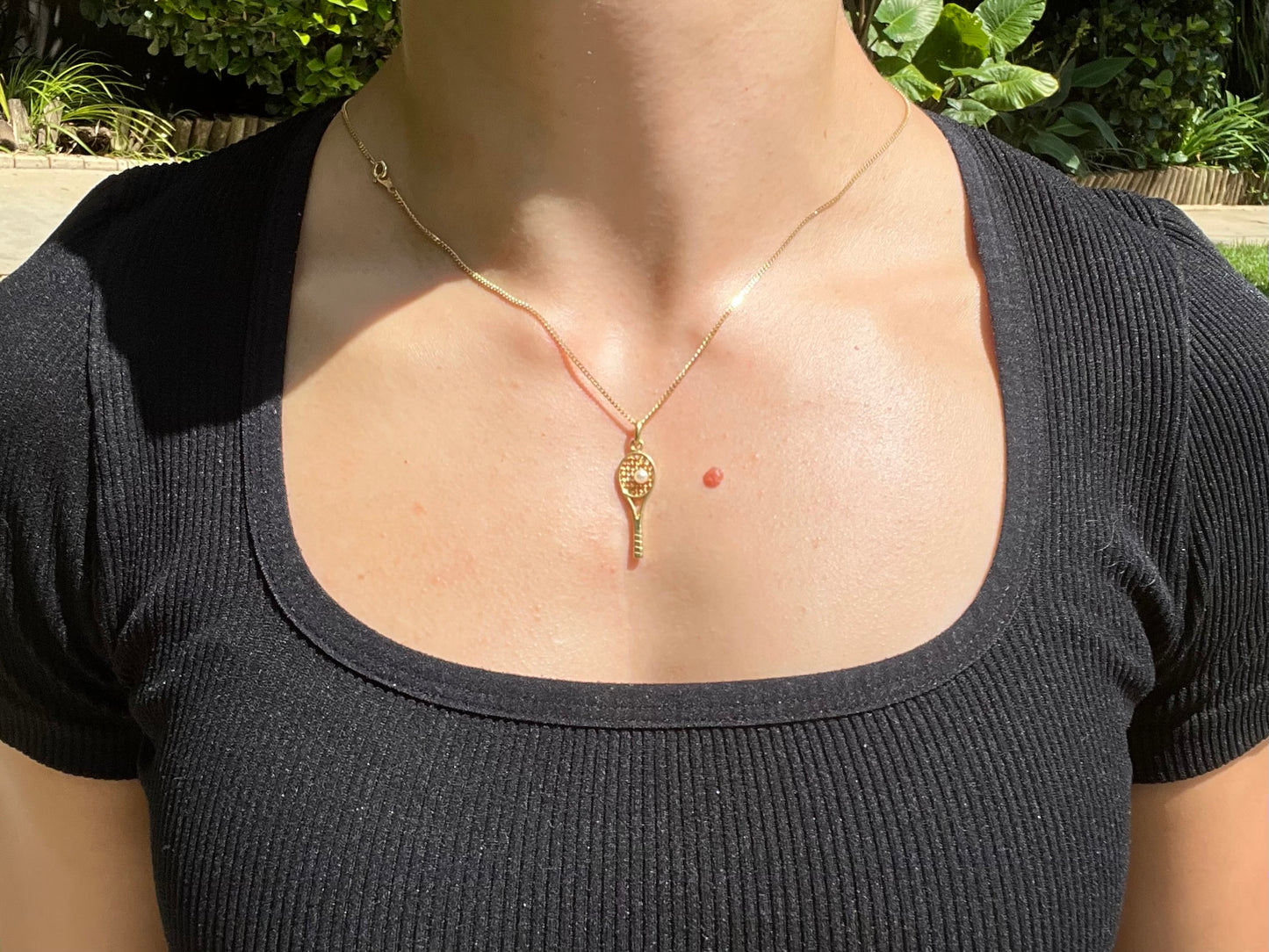 Vintage, 9K gold tennis racket and pearl ball pendant