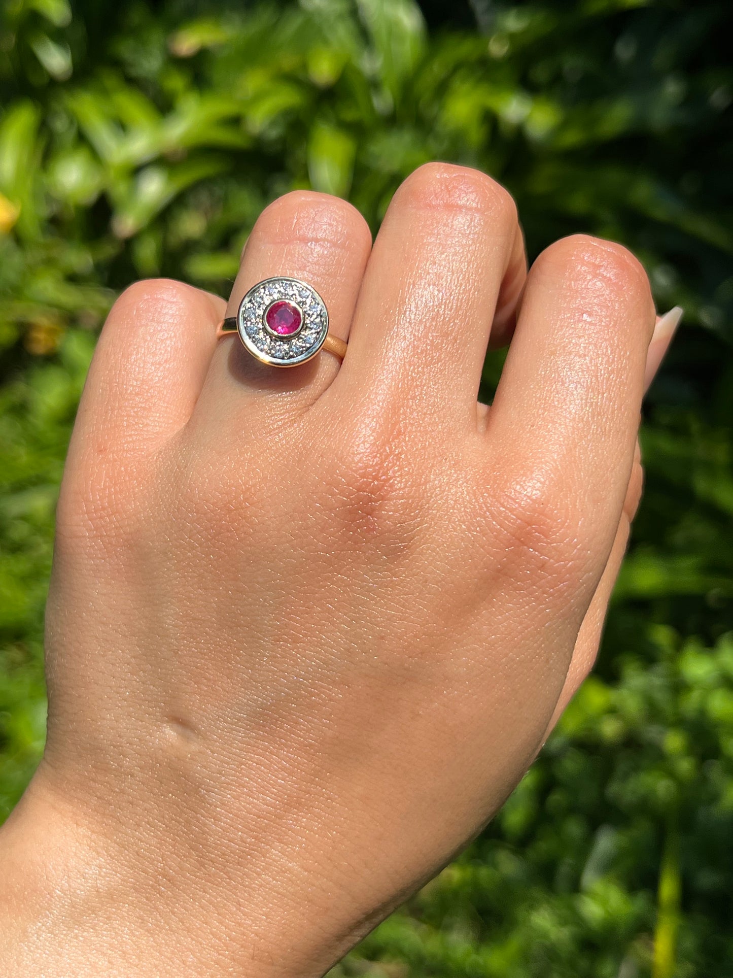 Vintage, 18K gold ruby and diamond halo ring