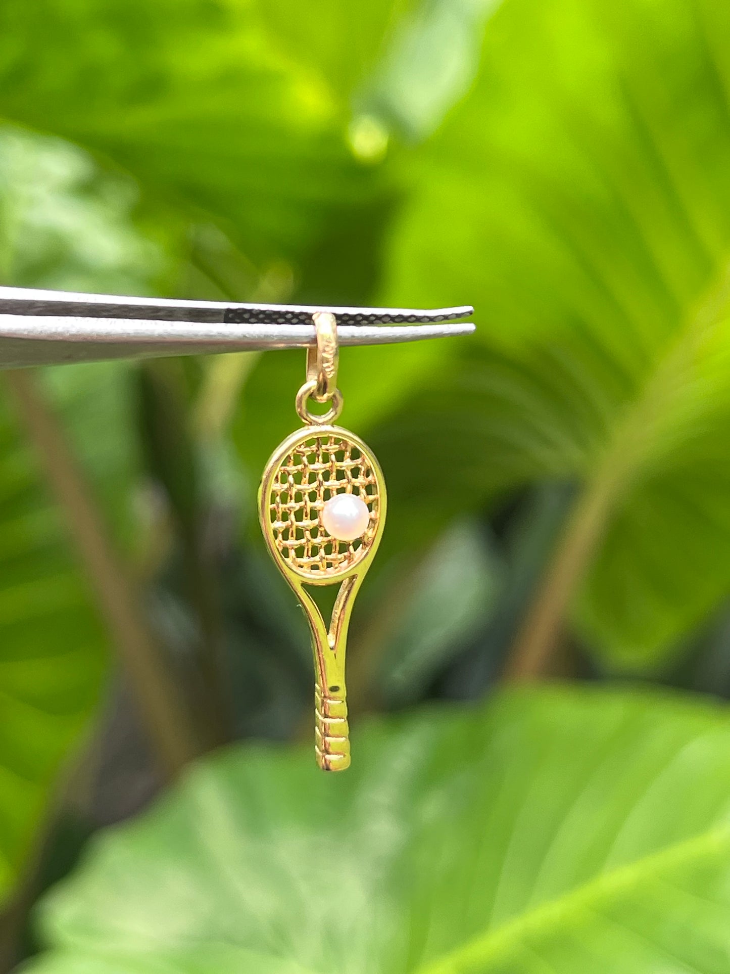 Vintage, 9K gold tennis racket and pearl ball pendant