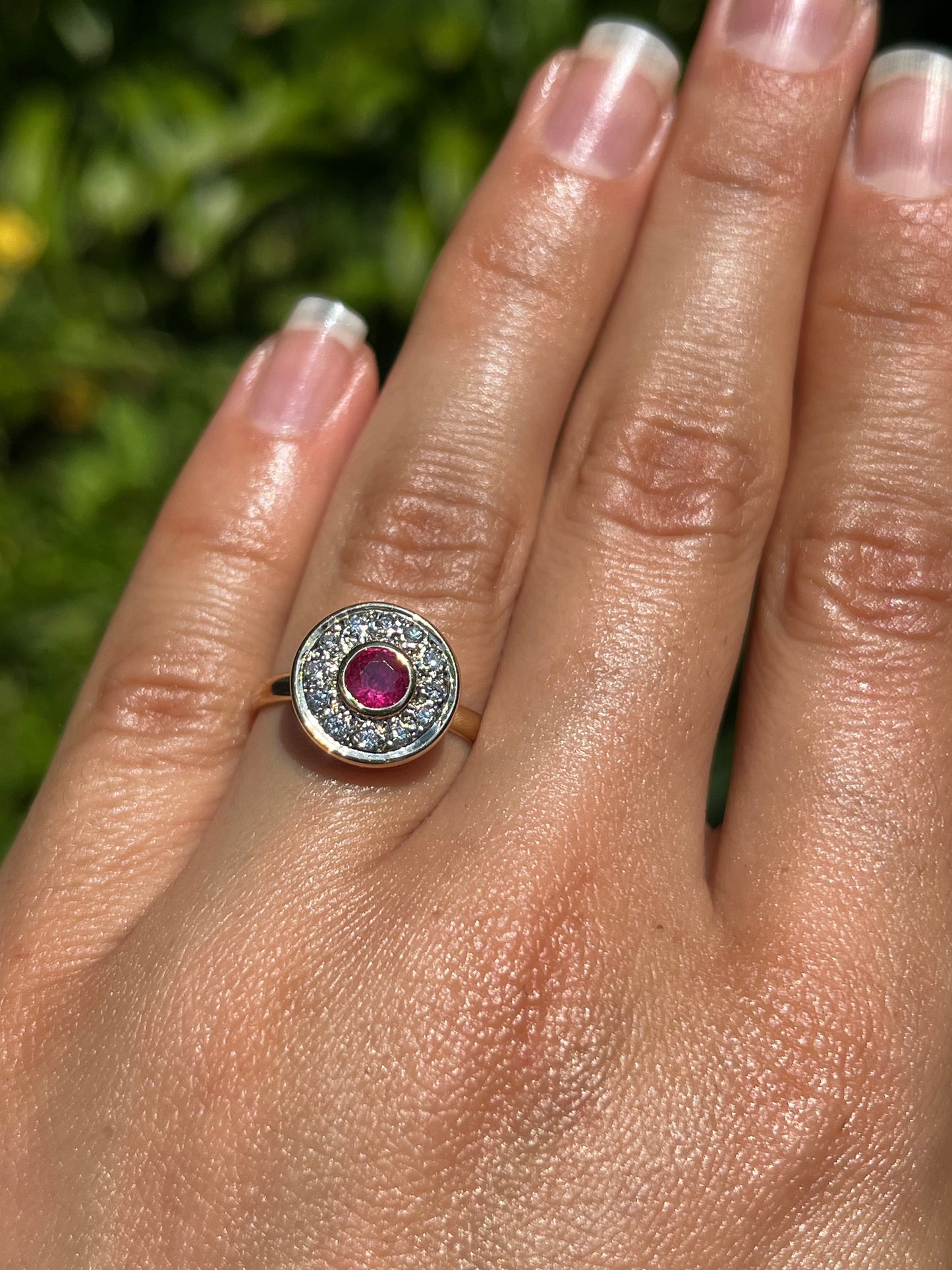 Vintage, 18K gold ruby and diamond halo ring