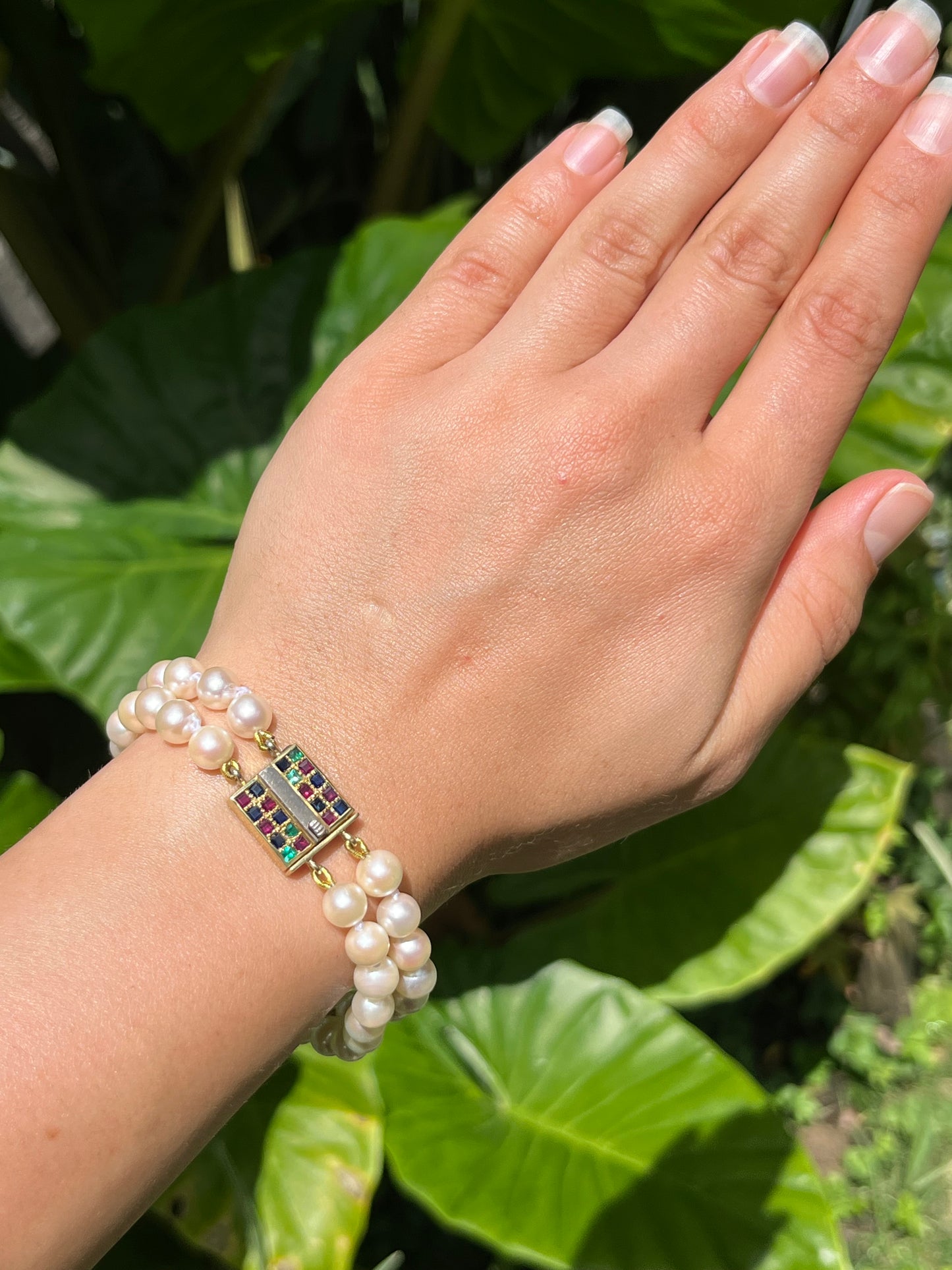 Mid-century, 18K gold double-strand cultured pearl, ruby, sapphire and emerald bracelet