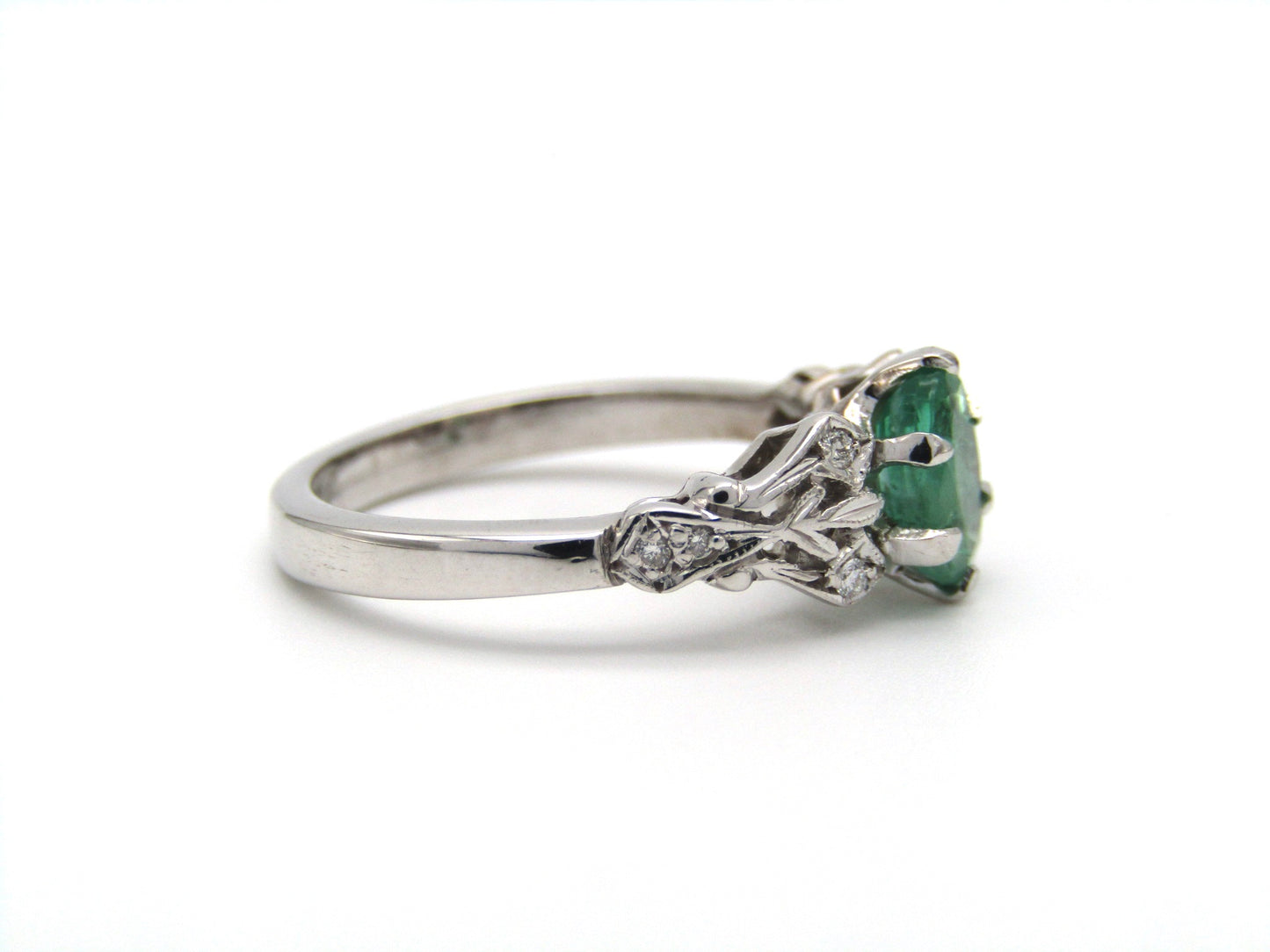 Estate, 18K gold emerald and diamond ring by Jack Friedman