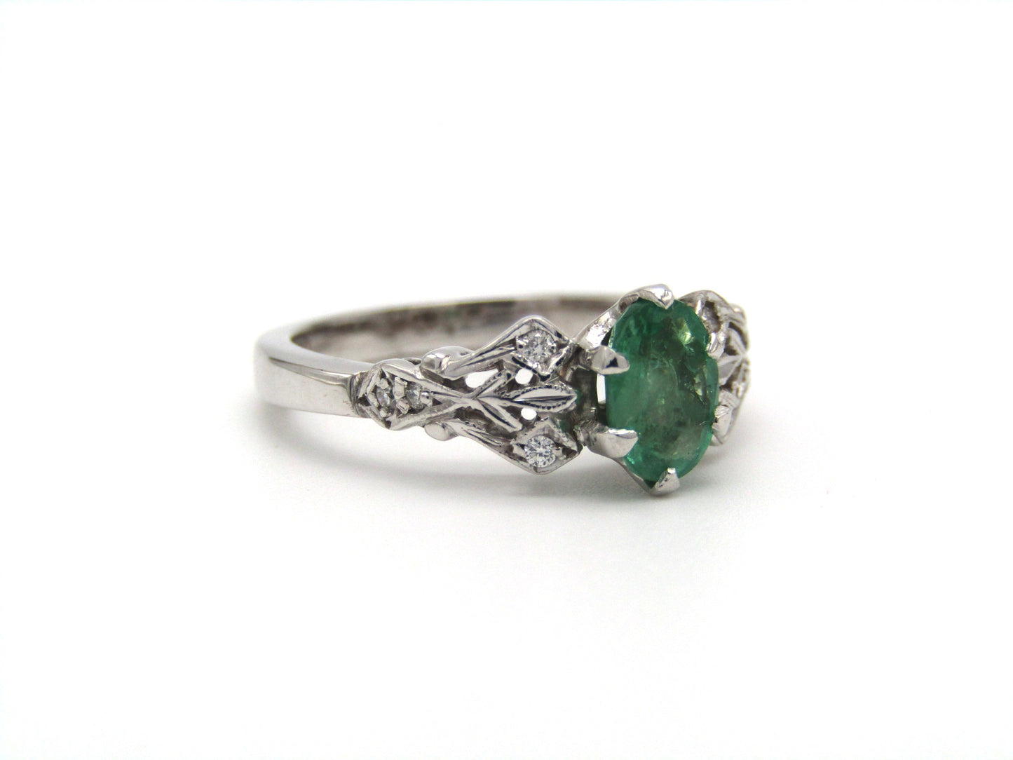 Estate, 18K gold emerald and diamond ring by Jack Friedman