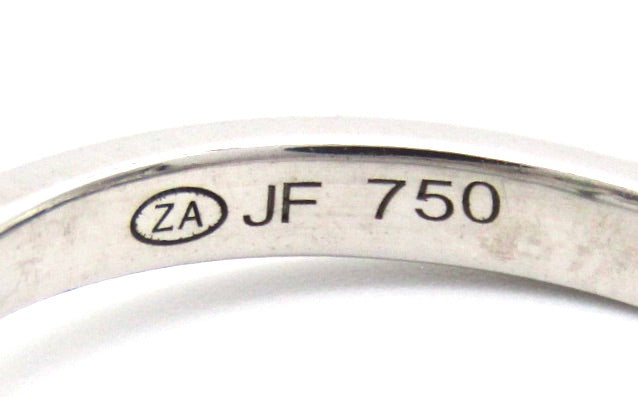 Estate, 18K gold emerald and diamond ring by Jack Friedman