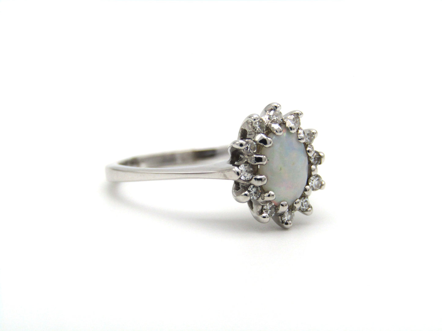 Estate, 14K gold opal and diamond halo ring