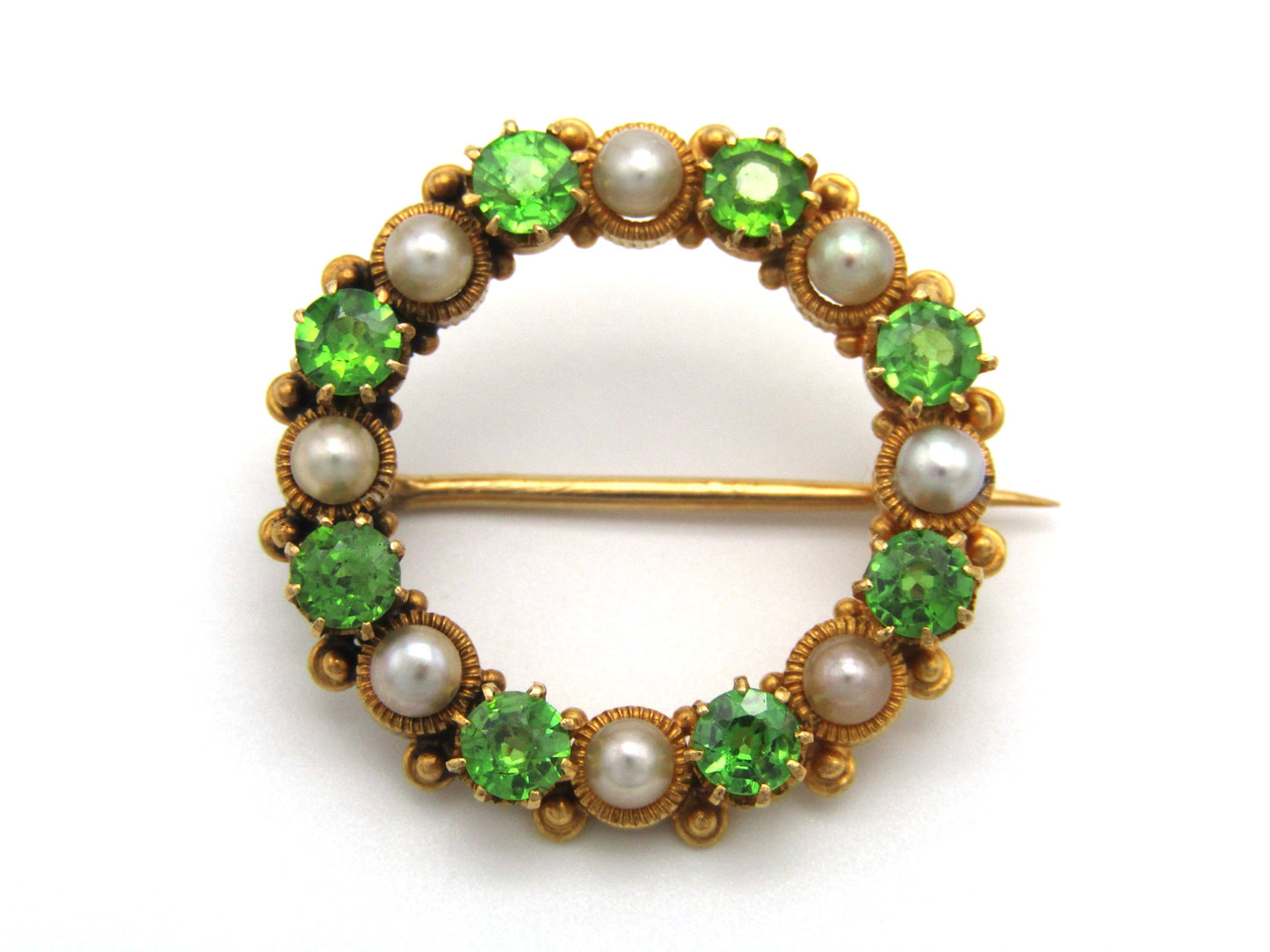 Edwardian, 18K gold demantoid garnet and pearl circle brooch