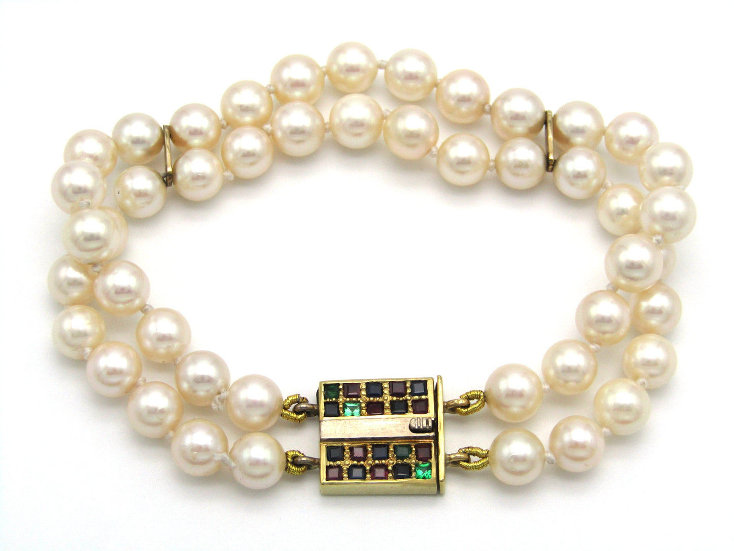 Mid-century, 18K gold double-strand cultured pearl, ruby, sapphire and emerald bracelet