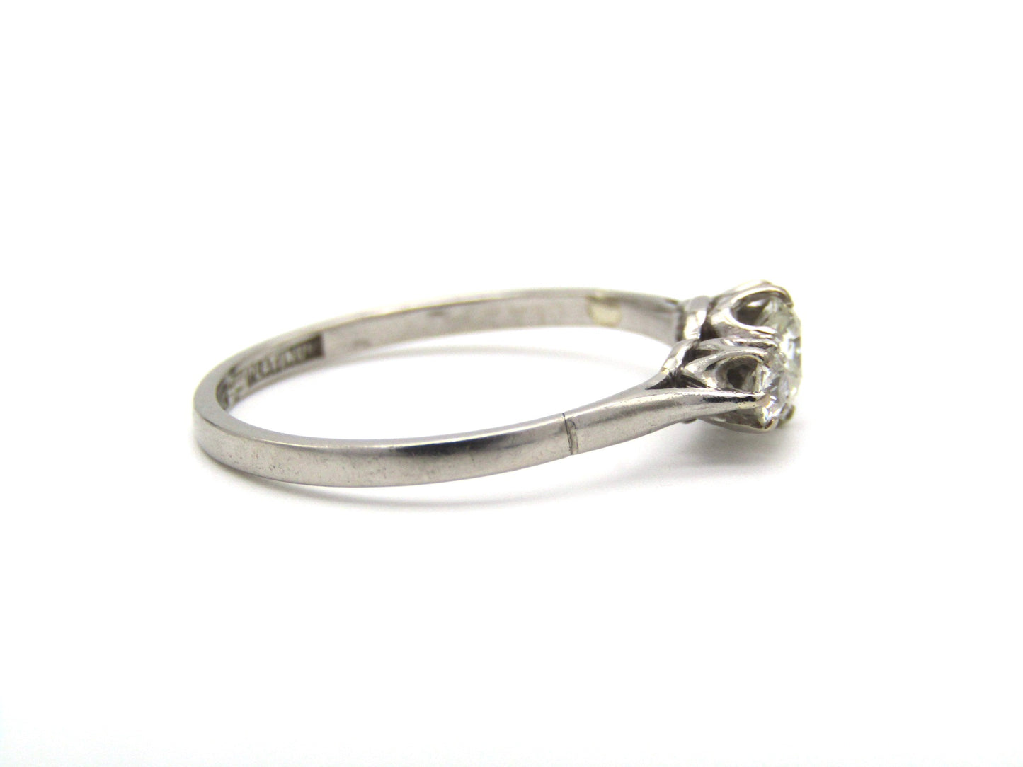 Art Deco, platinum and diamond three-stone engagement ring by William Wilkinson Ltd