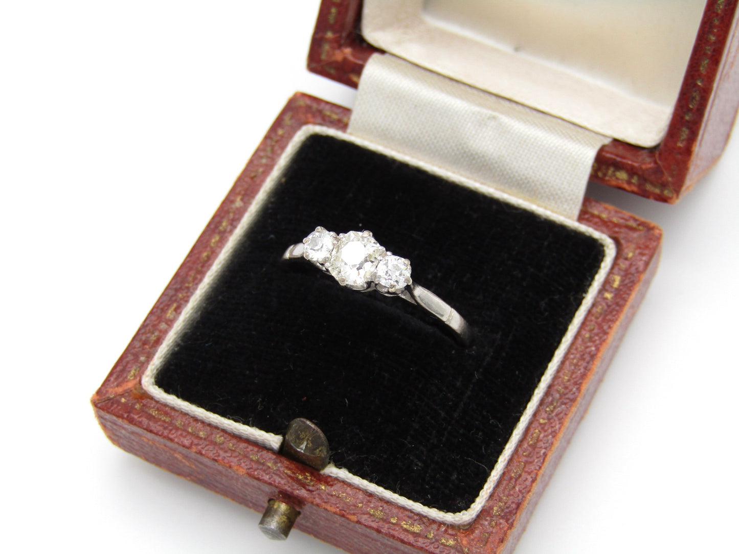 Art Deco, platinum and diamond three-stone engagement ring by William Wilkinson Ltd
