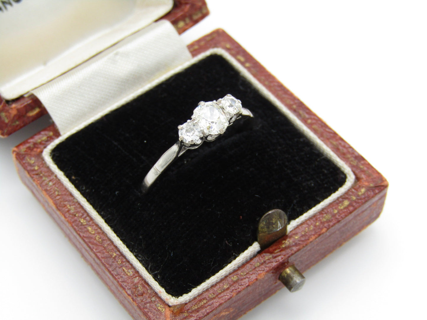 Art Deco, platinum and diamond three-stone engagement ring by William Wilkinson Ltd