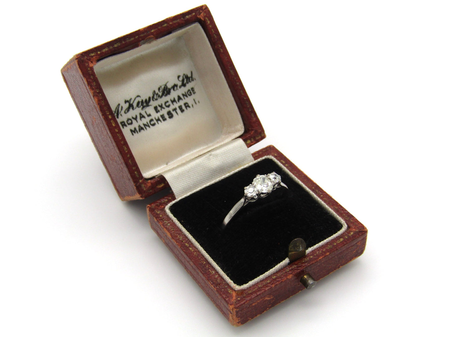 Art Deco, platinum and diamond three-stone engagement ring by William Wilkinson Ltd