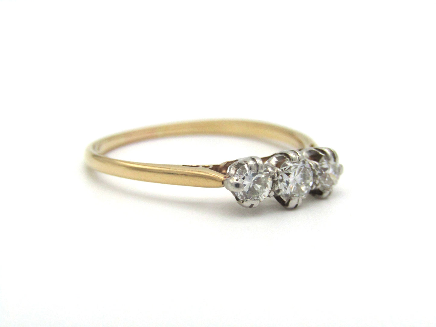 Mid-century 18K gold and platinum three-stone diamond ring