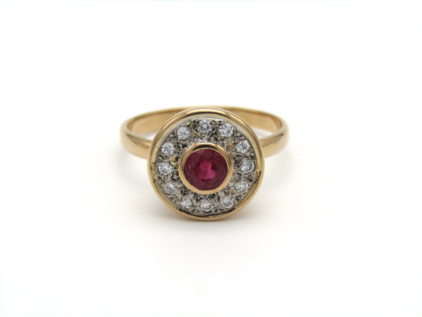 Vintage, 18K gold ruby and diamond halo ring
