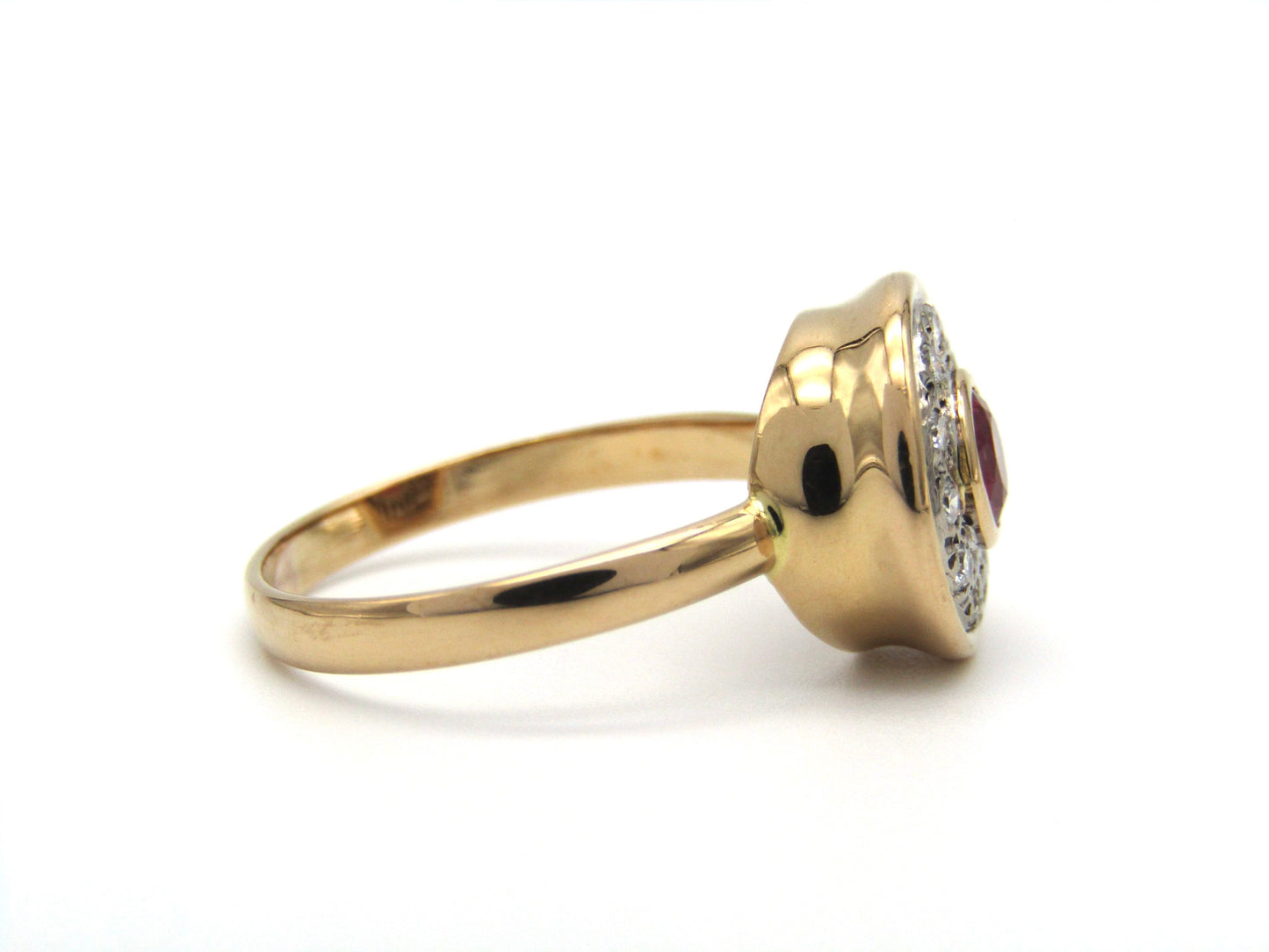 Vintage, 18K gold ruby and diamond halo ring