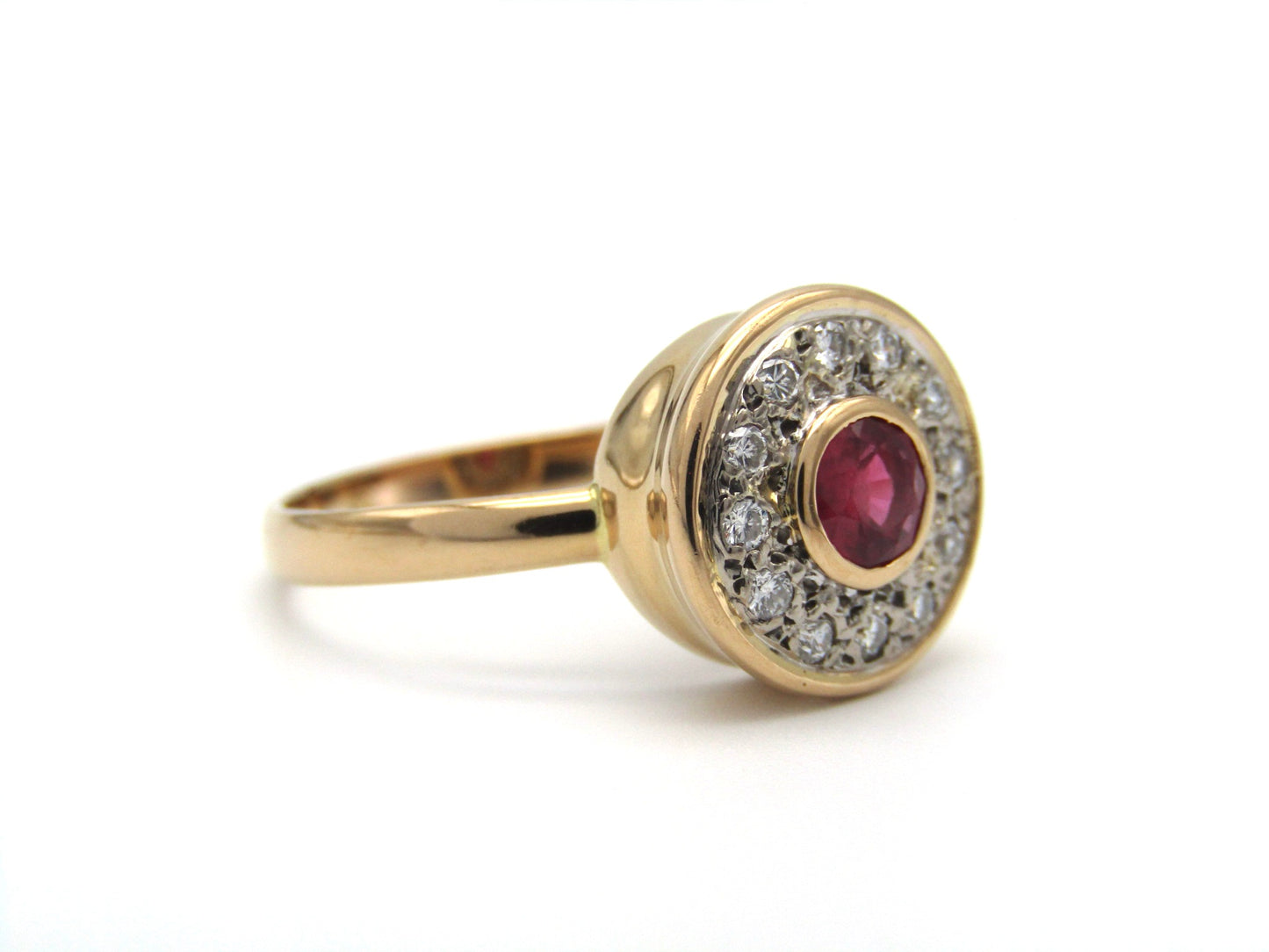 Vintage, 18K gold ruby and diamond halo ring