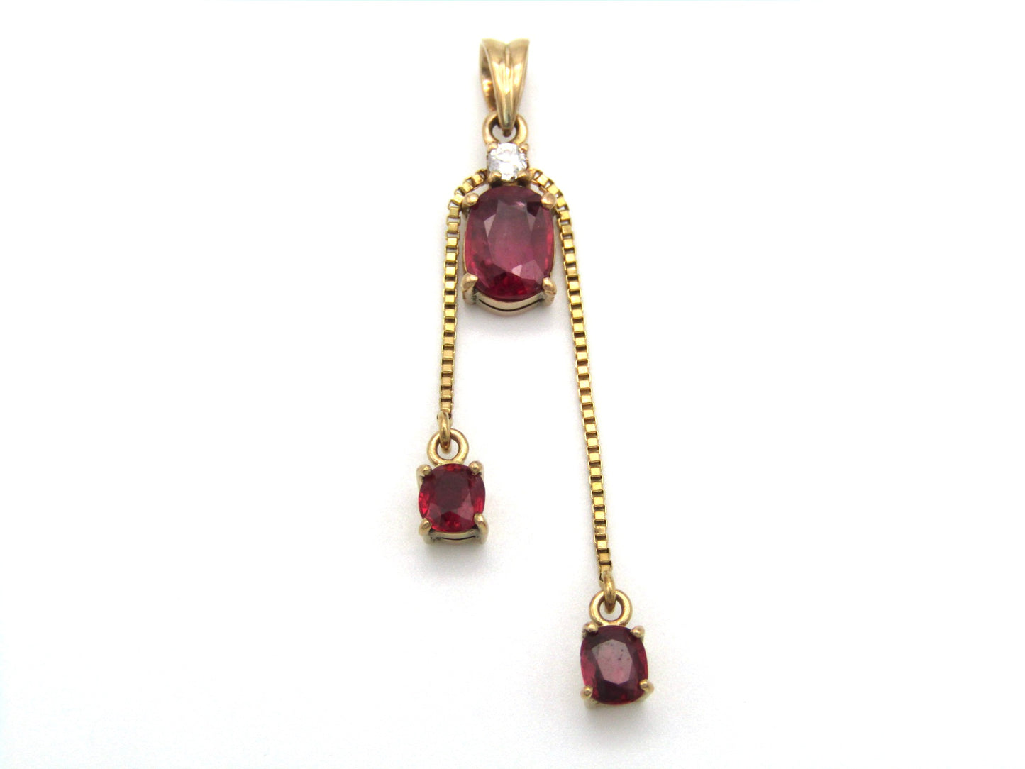 Mid-century, 14K gold ruby and diamond tassel pendant