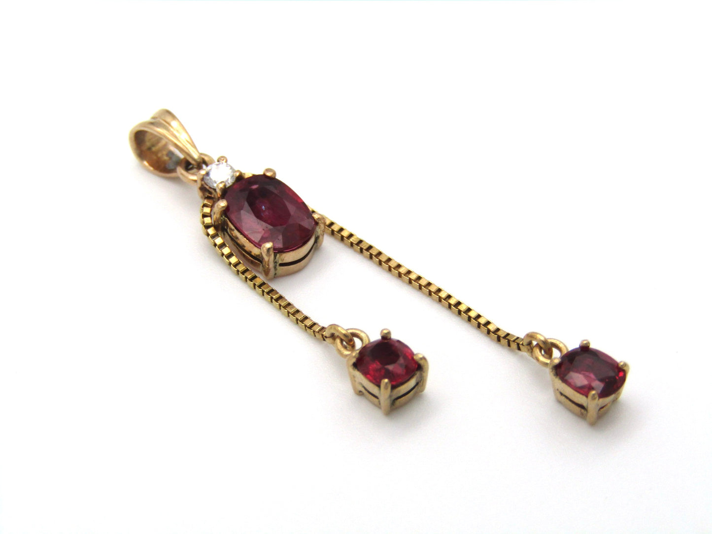 Mid-century, 14K gold ruby and diamond tassel pendant