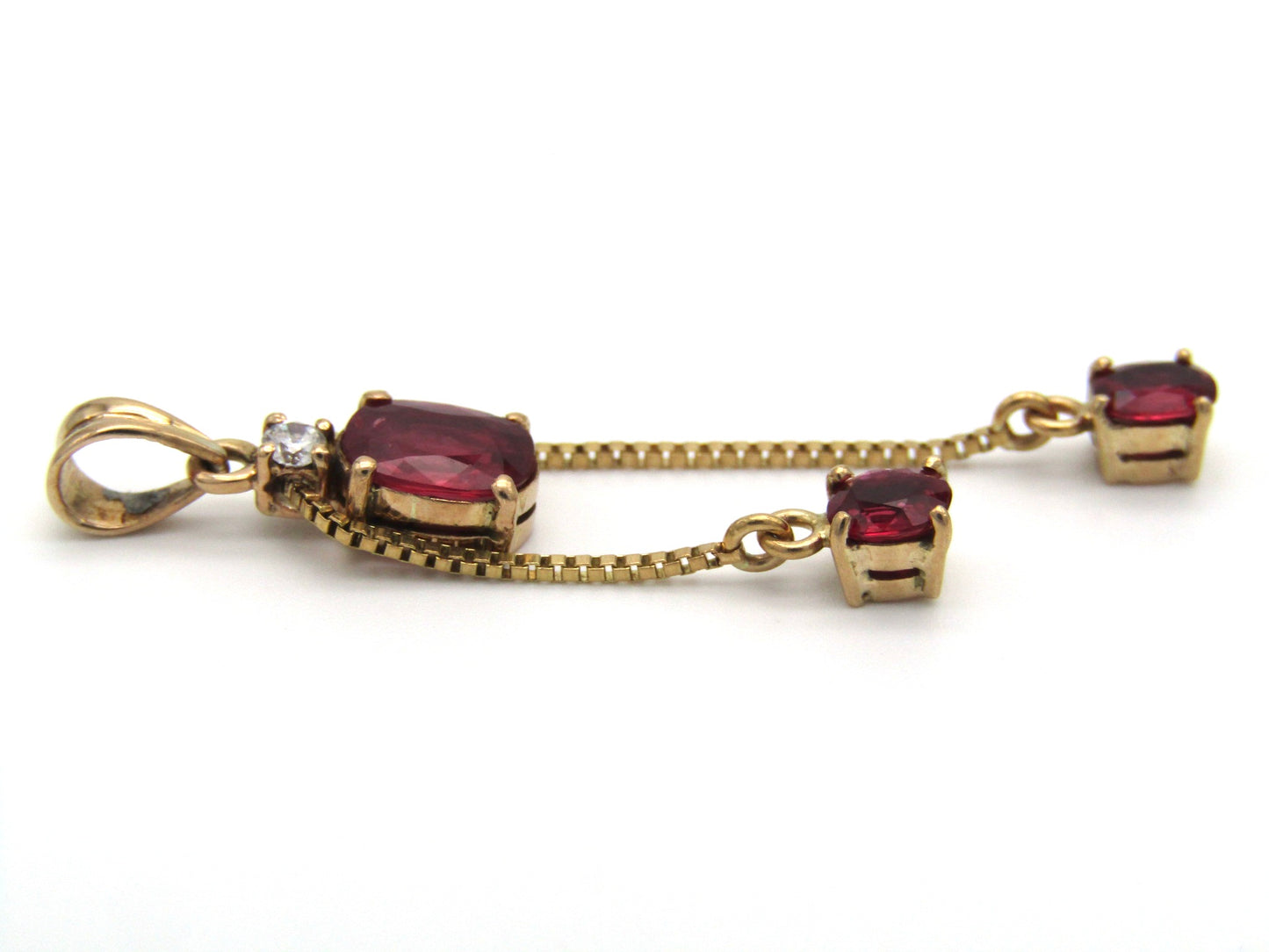 Mid-century, 14K gold ruby and diamond tassel pendant