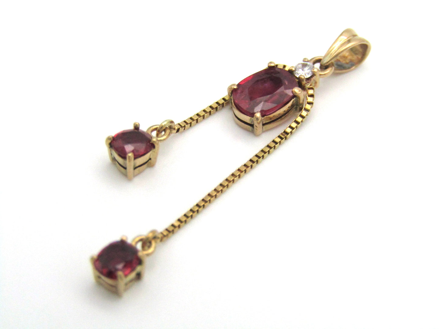 Mid-century, 14K gold ruby and diamond tassel pendant
