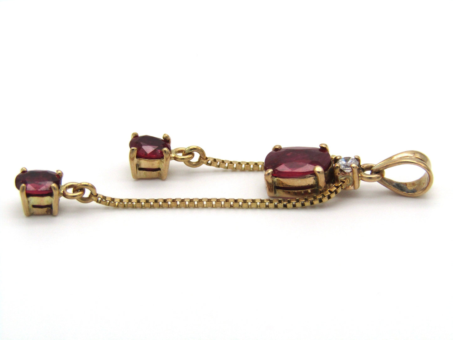 Mid-century, 14K gold ruby and diamond tassel pendant