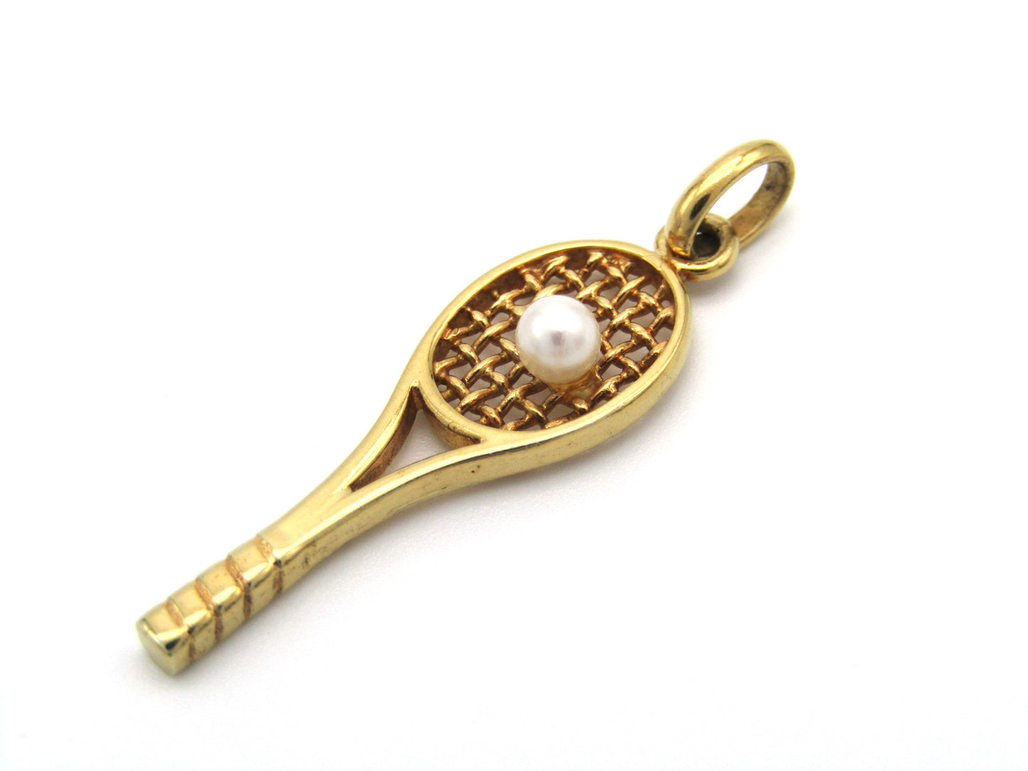 Vintage, 9K gold tennis racket and pearl ball pendant