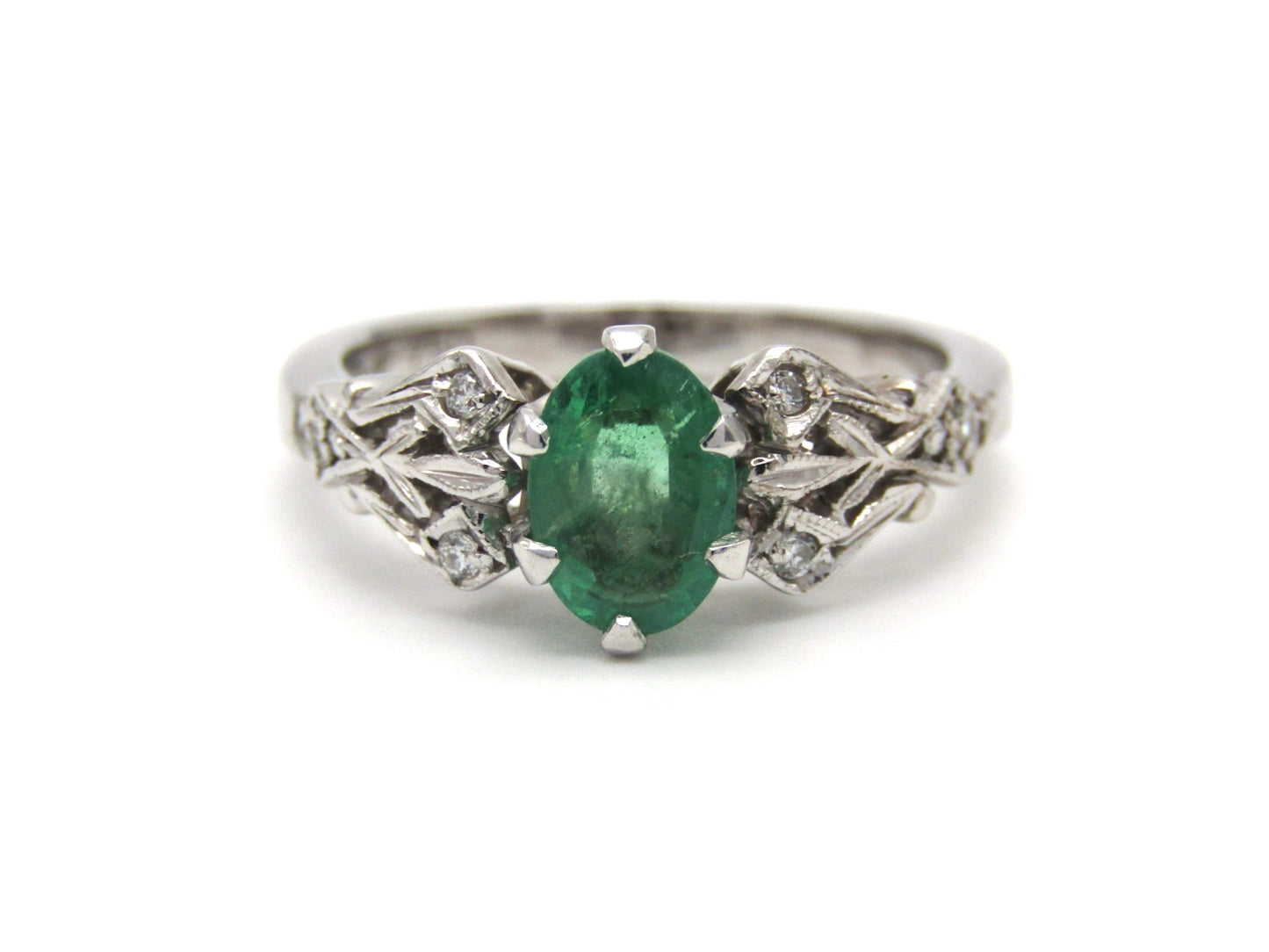 Estate, 18K gold emerald and diamond ring by Jack Friedman