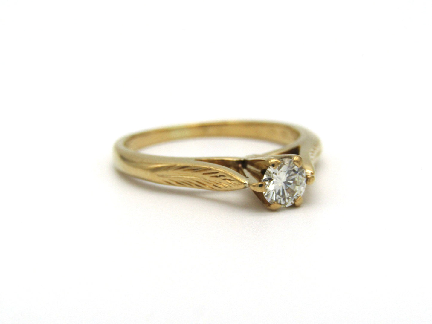 Mid-century, 18K gold diamond solitaire ring
