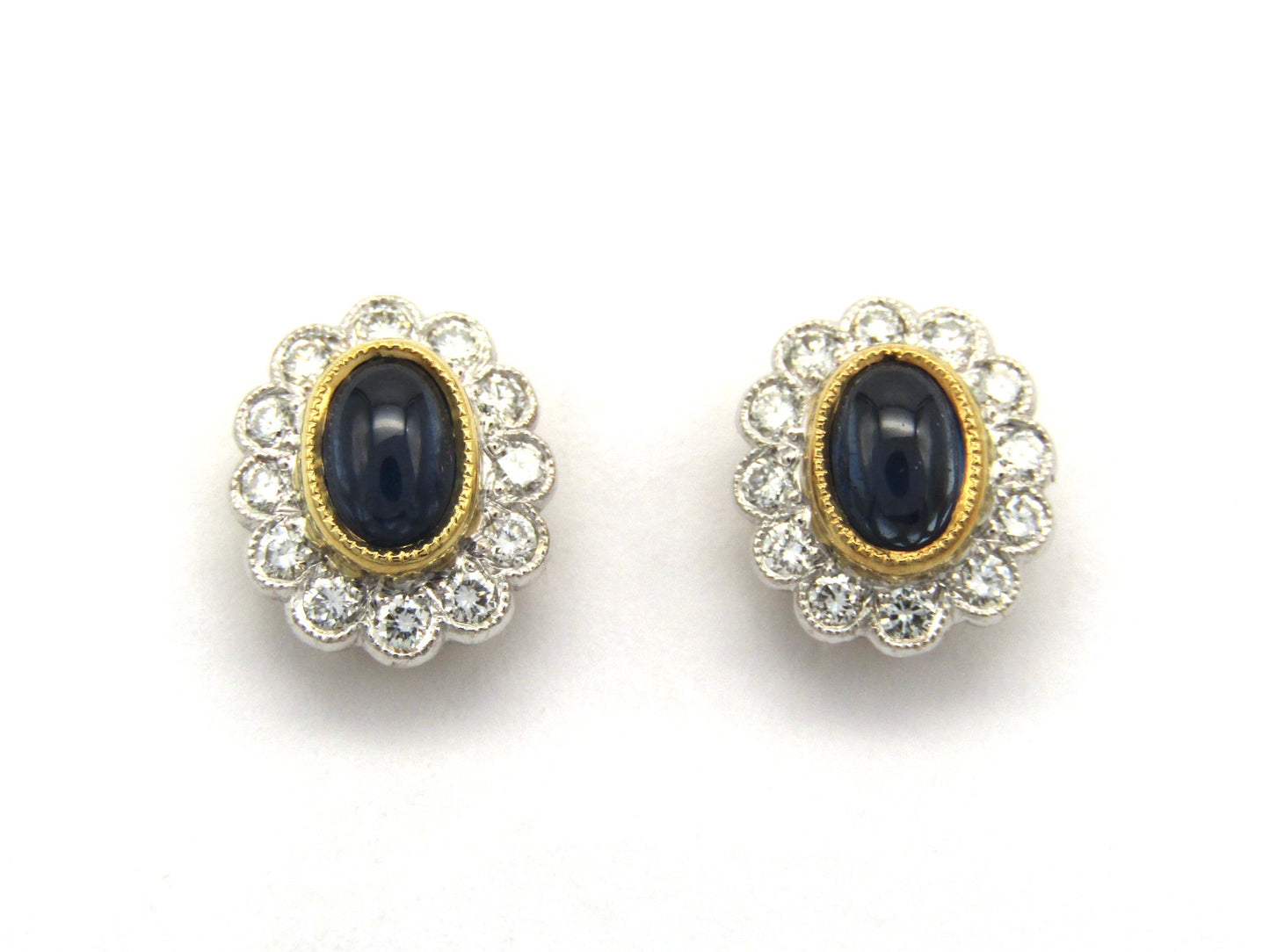 Estate, 18K gold sapphire and diamond earrings by Charles Greig