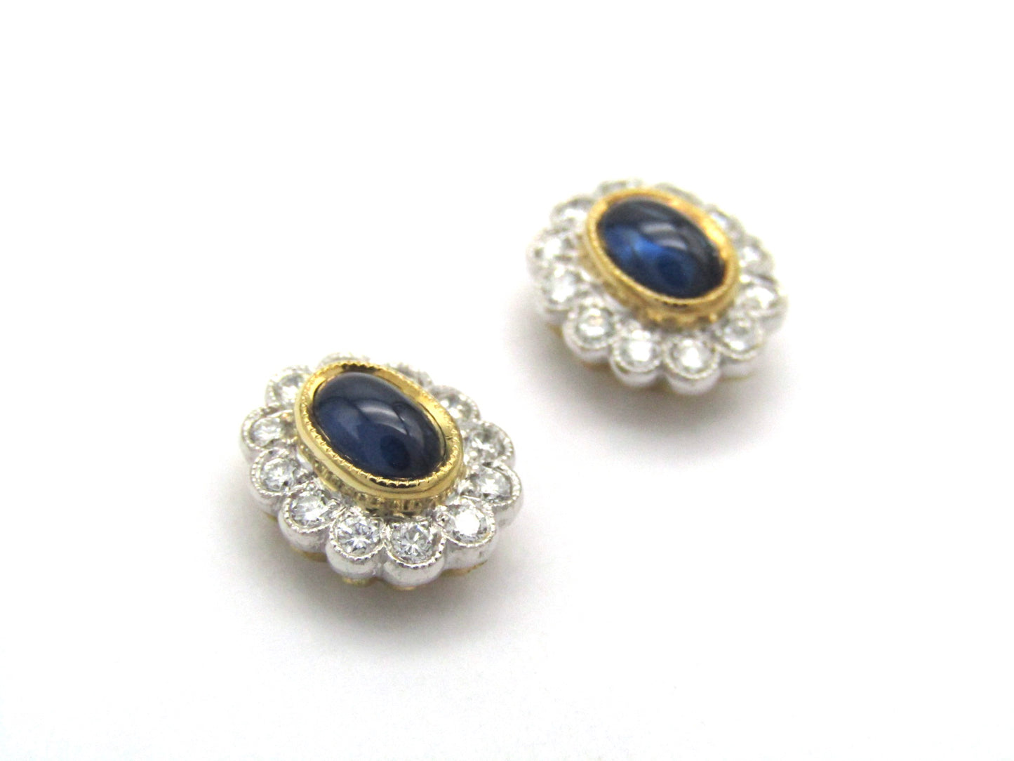 Estate, 18K gold sapphire and diamond earrings by Charles Greig