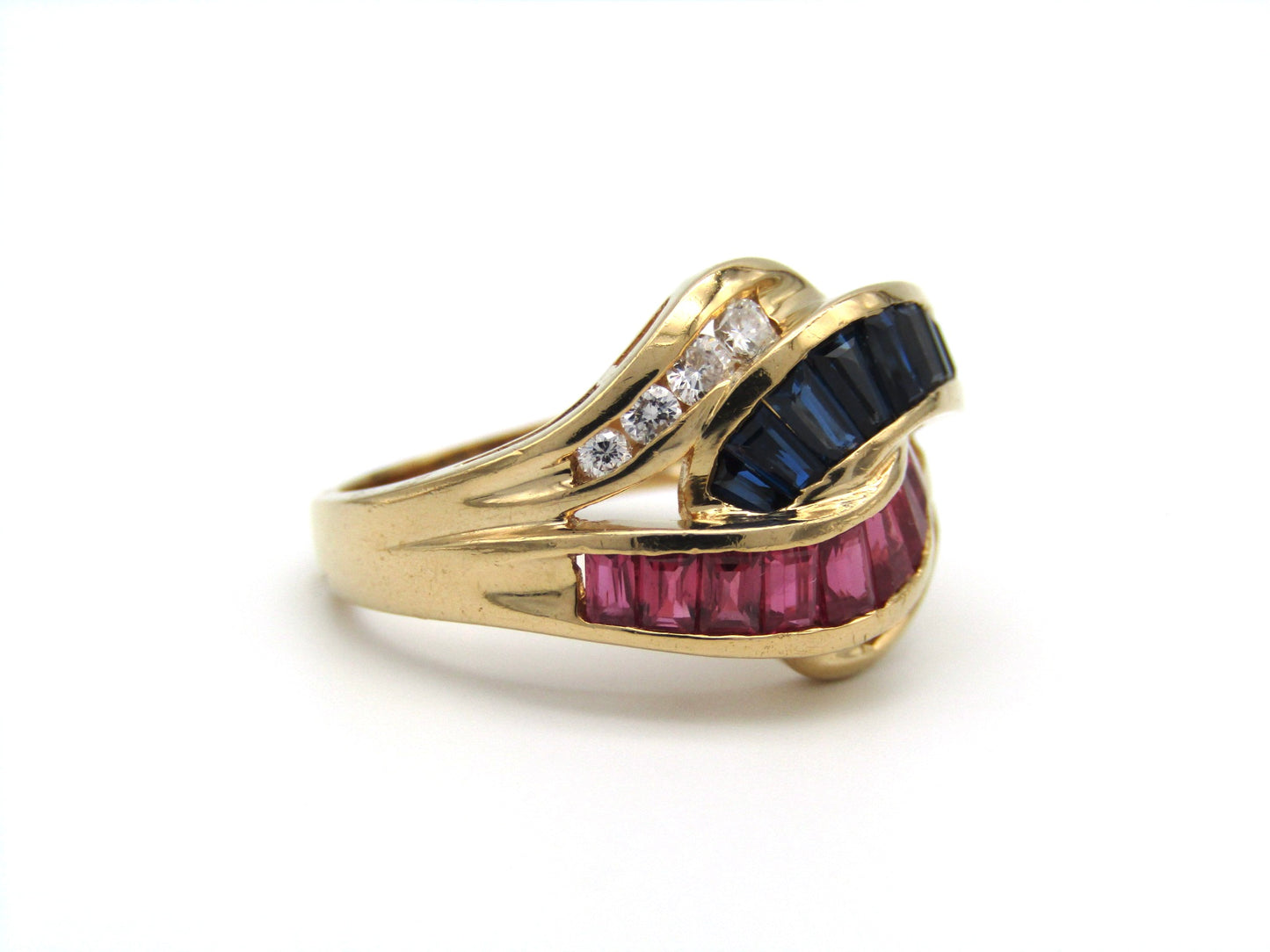 Vintage, 18K gold ruby, sapphire, and diamond bypass ring, c.1980s