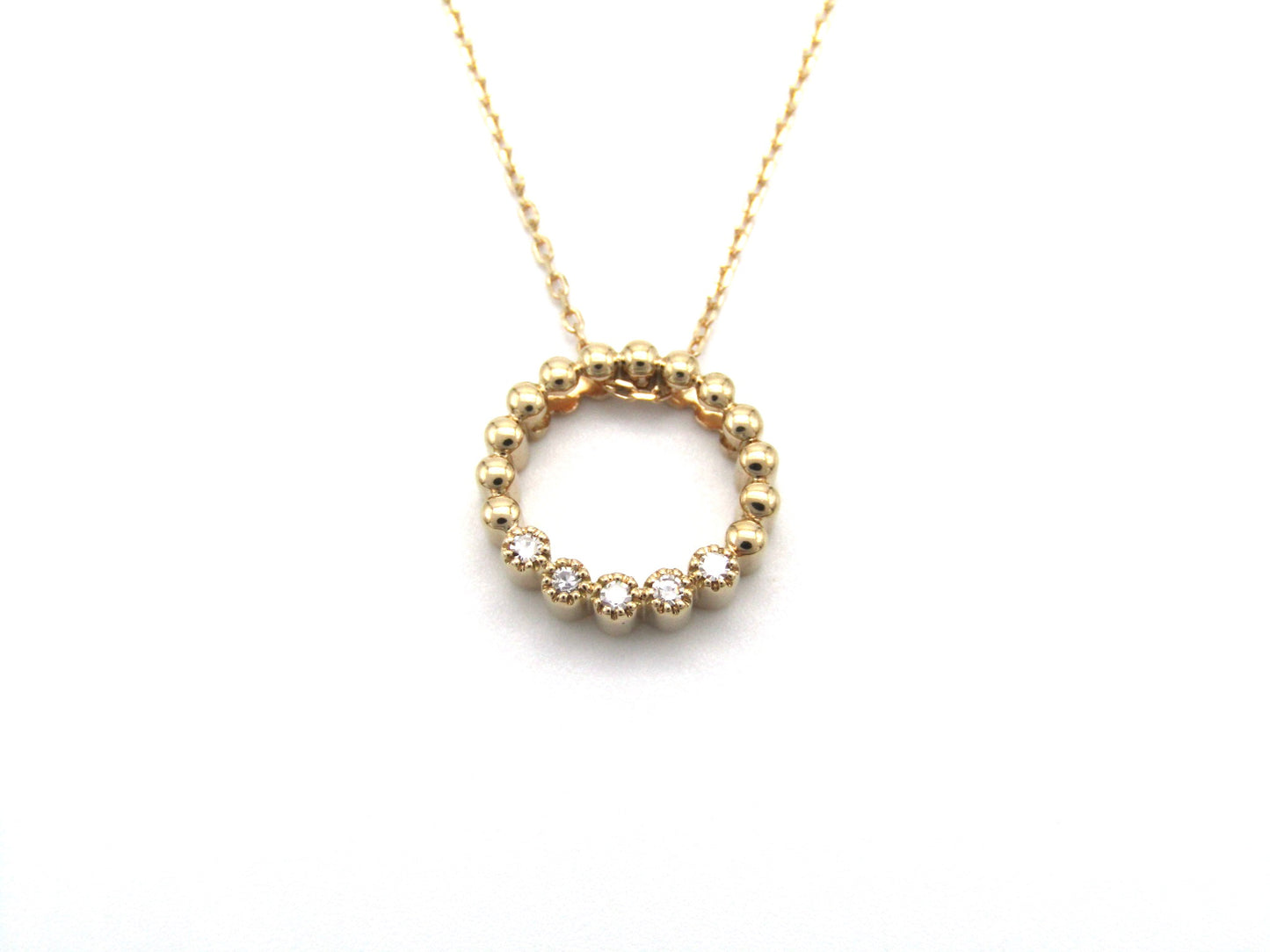 Estate, 9K gold diamond 'circle' pendant