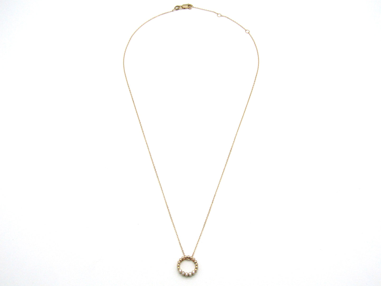 Estate, 9K gold diamond 'circle' pendant