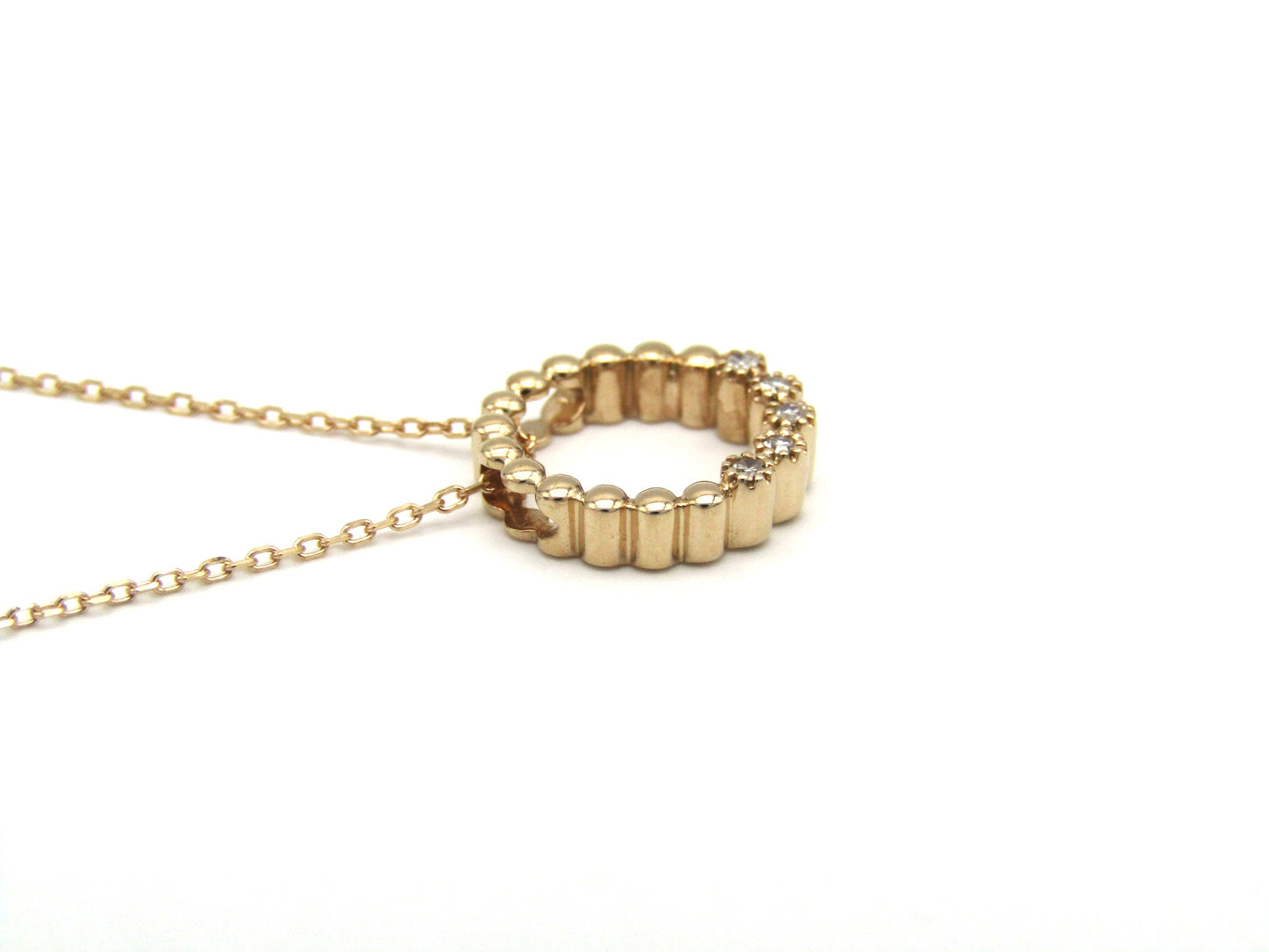Estate, 9K gold diamond 'circle' pendant