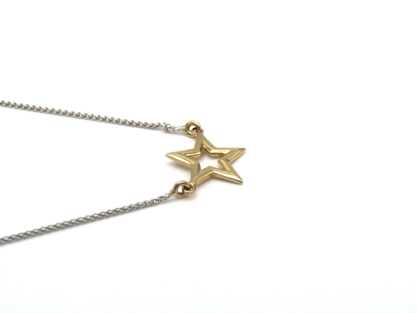 Estate, 9K gold 'star' necklace