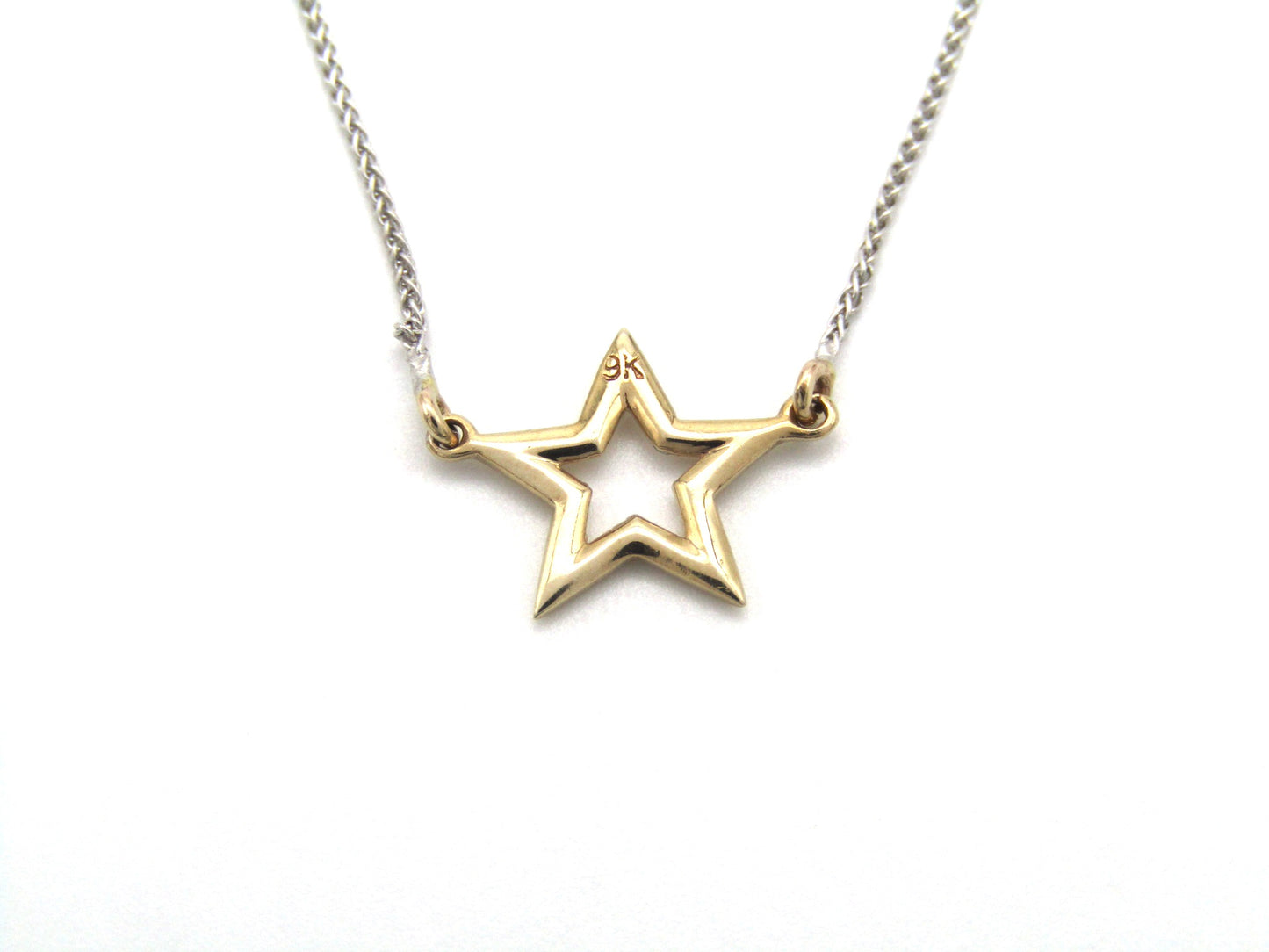 Estate, 9K gold 'star' necklace