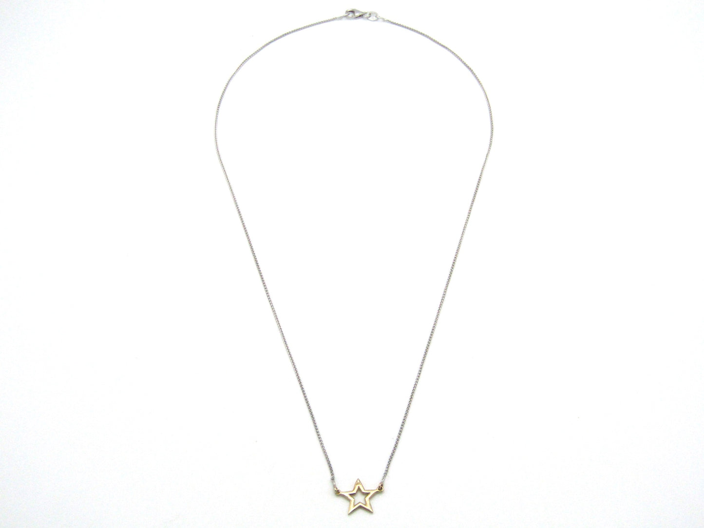 Estate, 9K gold 'star' necklace